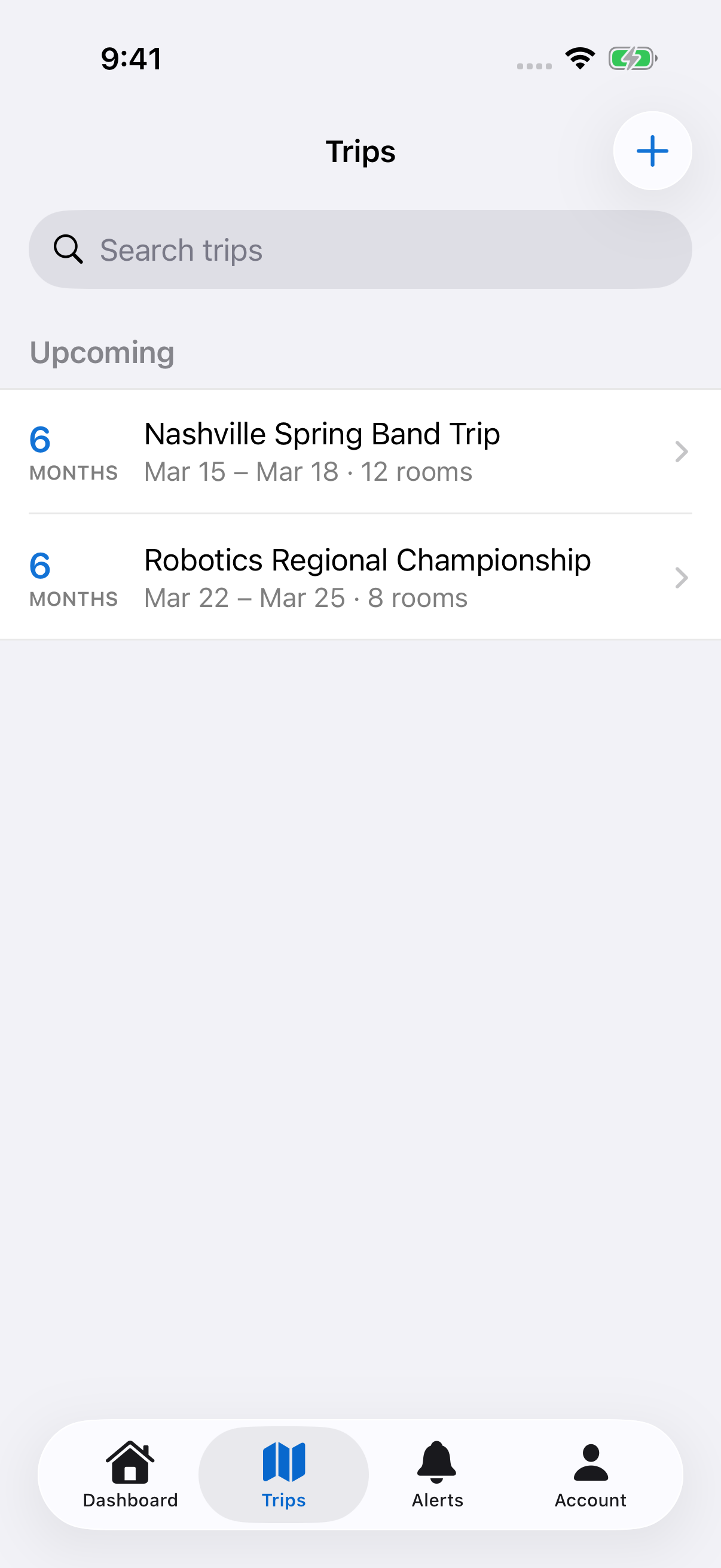 The iOS Trips screen with upcoming trips and the plus button for creating a trip